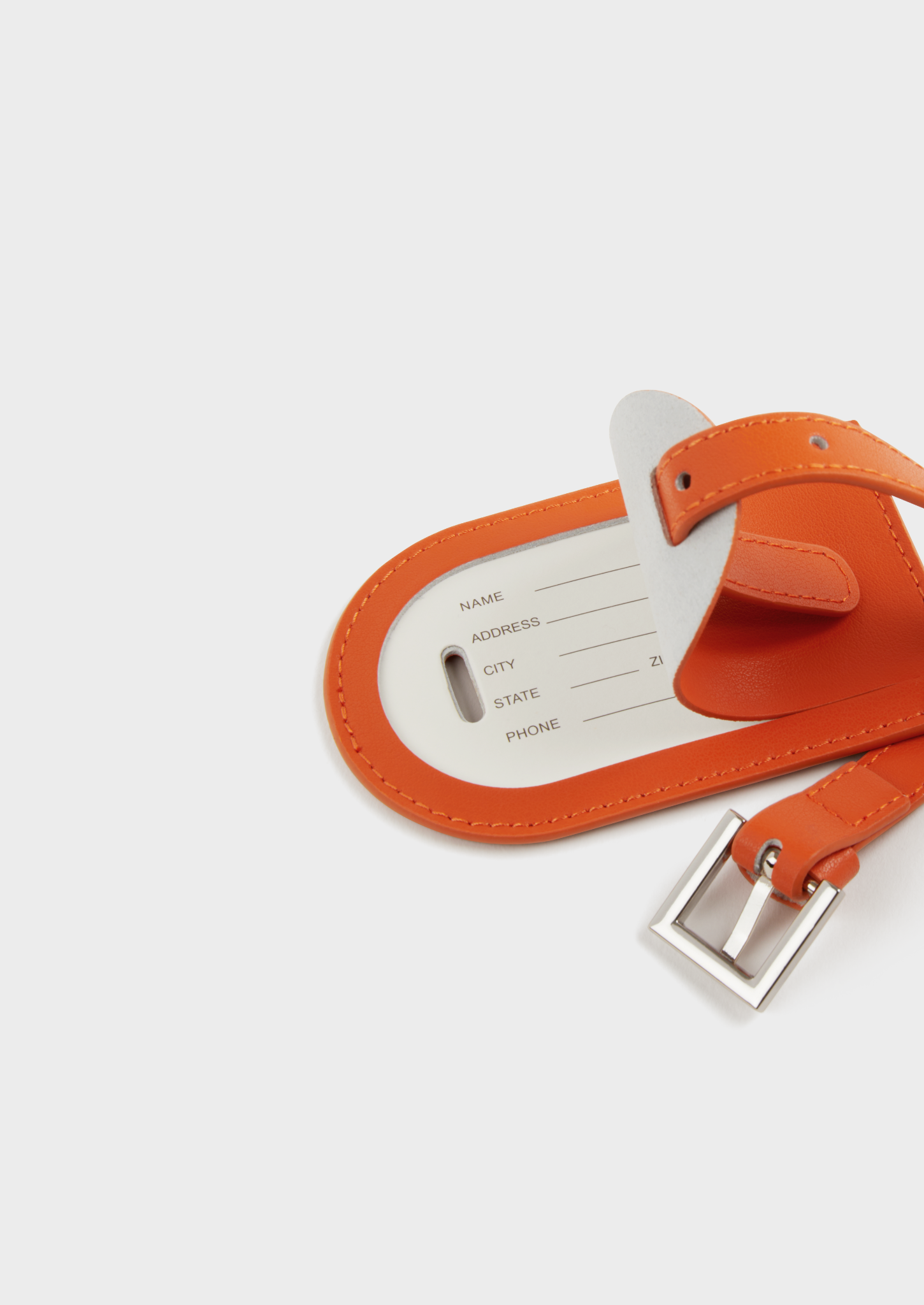 Porte-étiquette de bagage en cuir orange clair avec boucle argentée