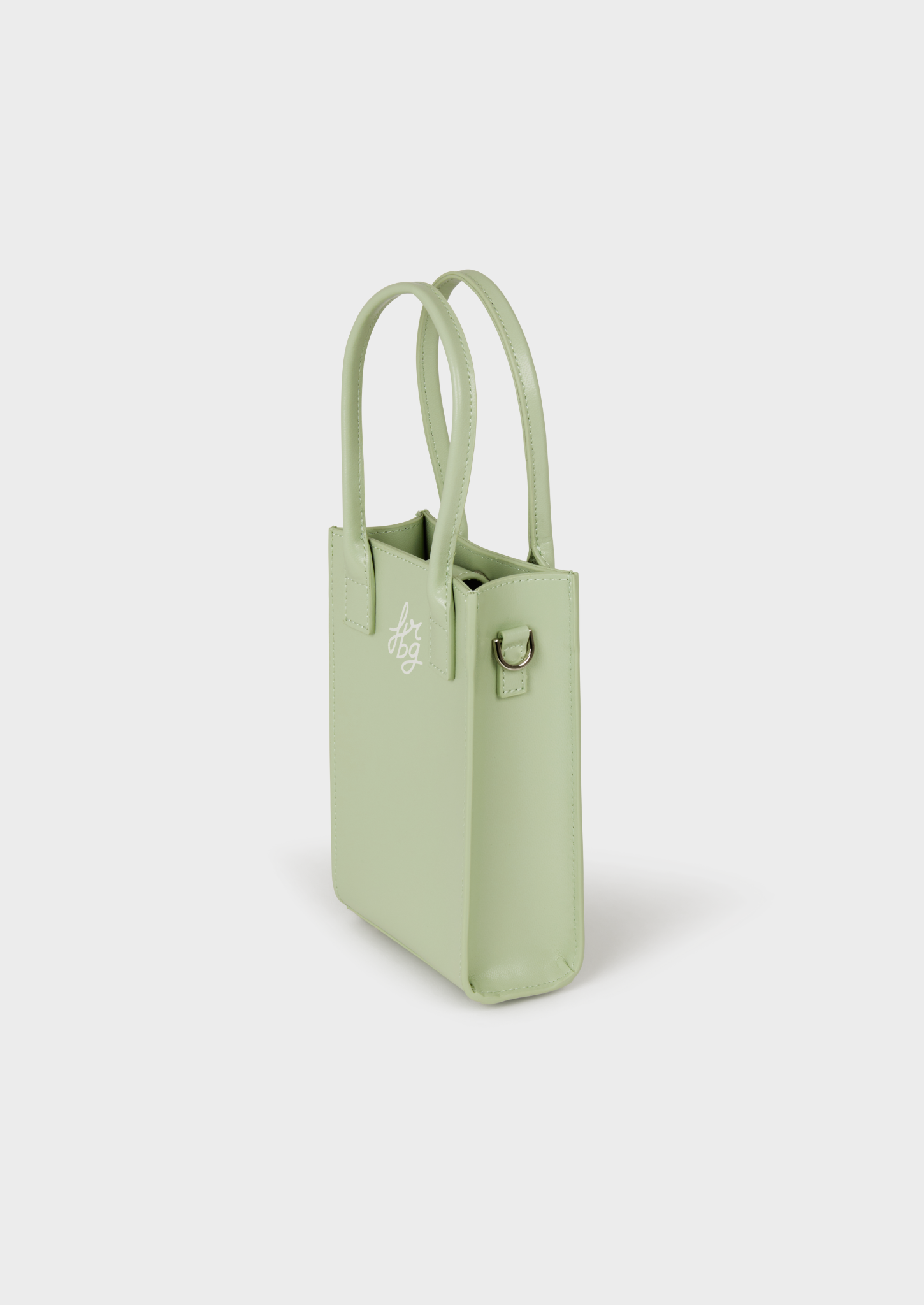 Petit sac vert clair en cuir, avec bandoulière et attache métallique