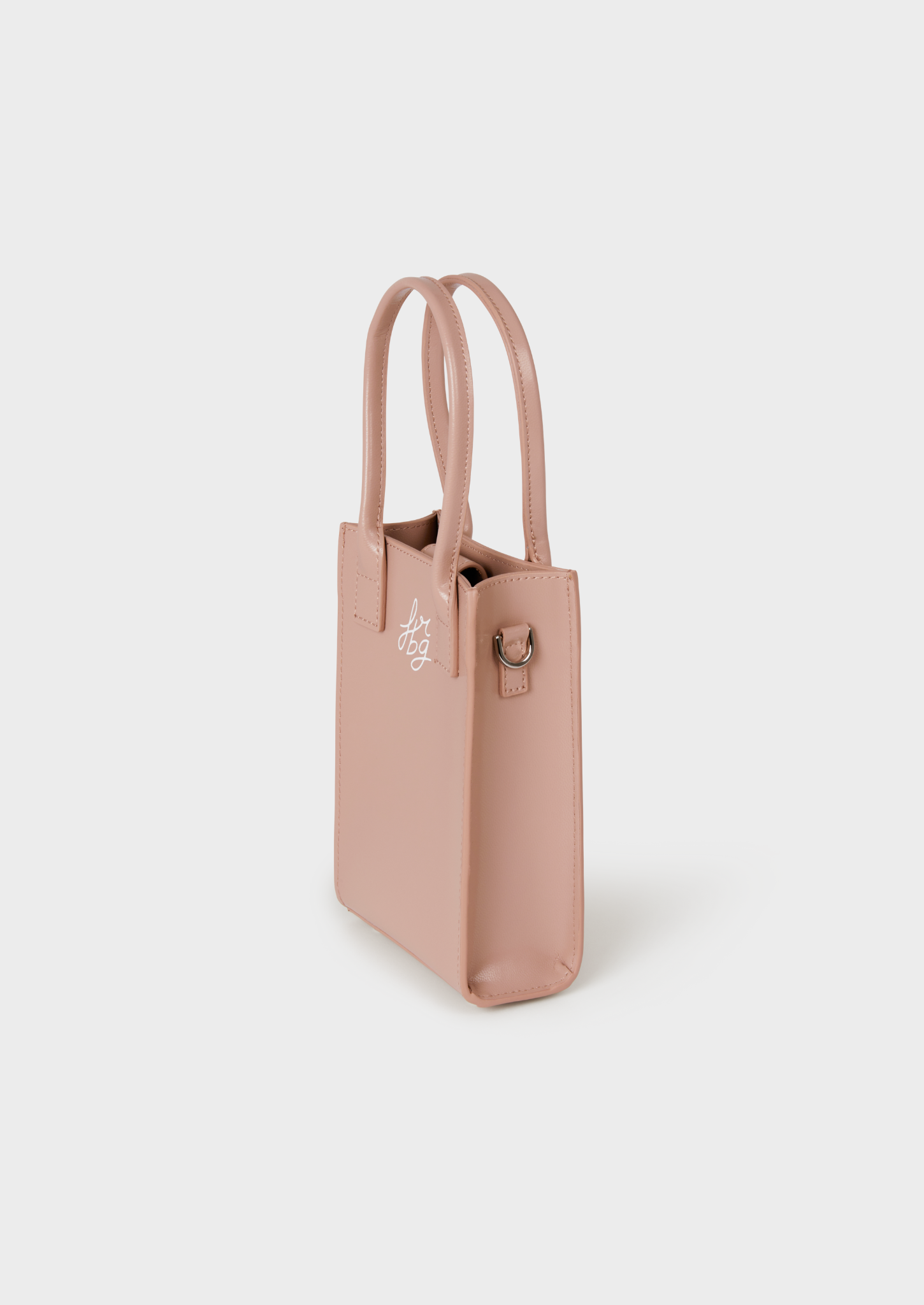 Petit sac rose clair en cuir avec poignées et logo gravé